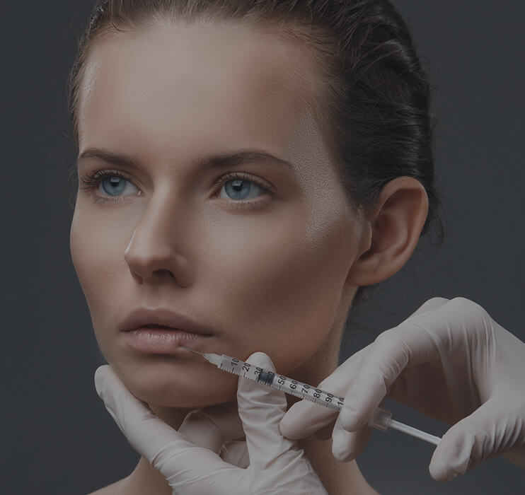 Picture of a woman receiving lip filler at Point of View Medical Aesthetics