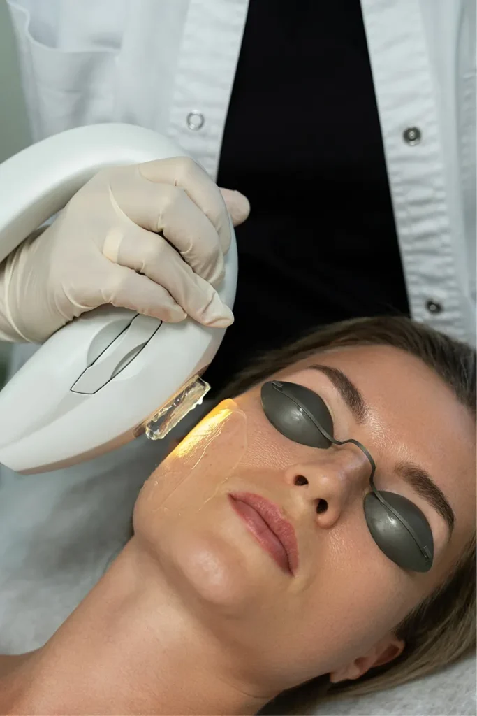 Woman receiving an IPL photo facial treatment at Point Of View Medical Aesthetics
