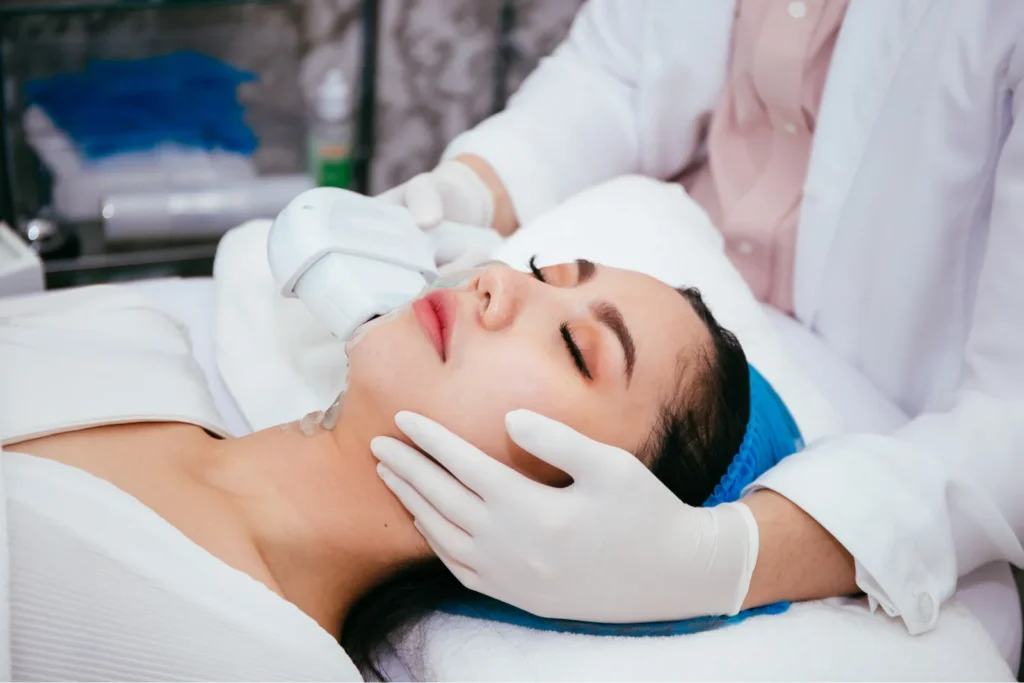 Woman receiving laser rejuvenation treatment at Point of View Medical Aesthetics in Calgary